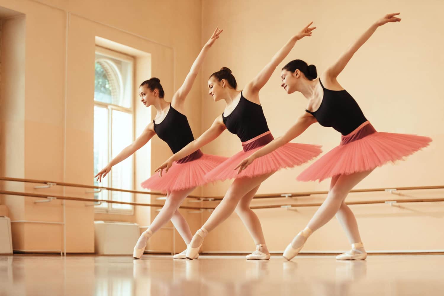 kompr small group of ballerinas dancing during rehearsal at ballet school
